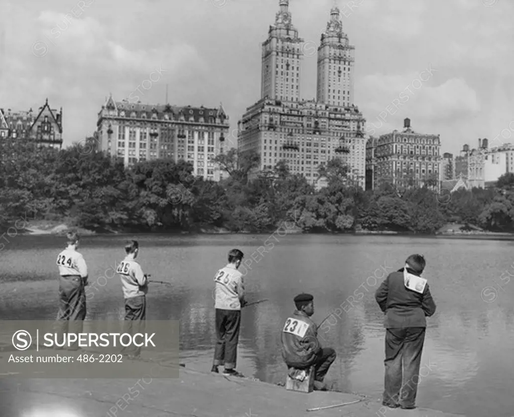USA, New York City, Central Park, Boys Fishing At 72d St. Lake, Prizes Were Given For The Largest Fish Caught, 1948