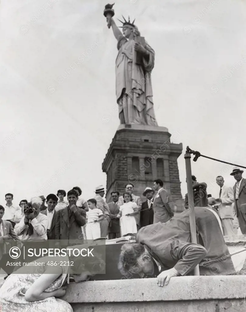 USA, New York City, Statue Of Liberty, People Kissing Foot Of Statue, 1951, Ourania Zaphiropoulos And Panaghiotis Karandreas, Two Of 32 Greek DP's Who Arrived Here Yesterday, Kiss The Ground At Foot Of Statue. 1951