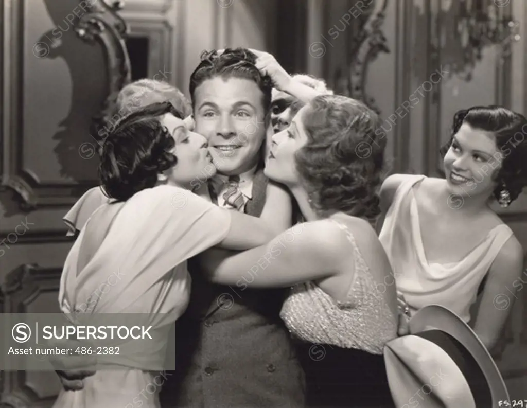 Women kissing Dick Powell, from ""Gold Diggers of 1933"", Exclusive in your city