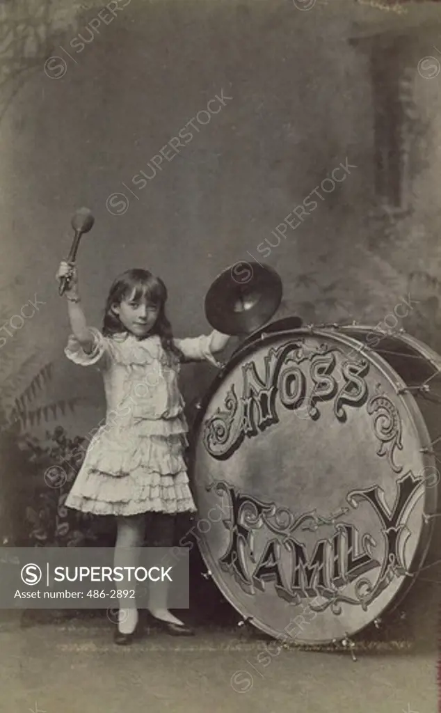Portrait of girl playing drum