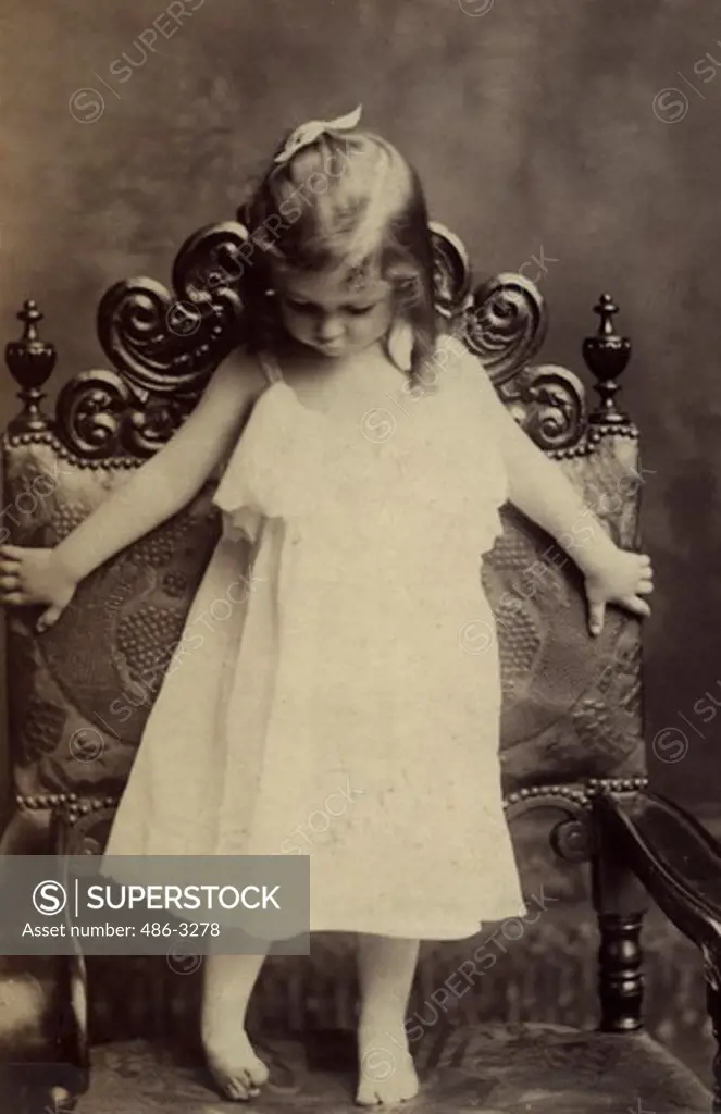 USA, Rhode Island, Newport, Portrait of girl standing on armchair, 1893