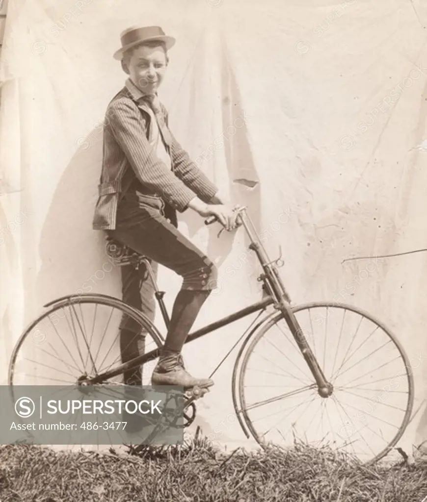Boy posing with bike