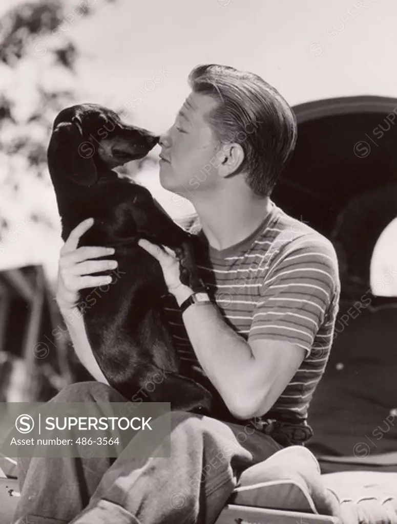 Mickey Rooney with dog, at home on his Van Nuys ranch