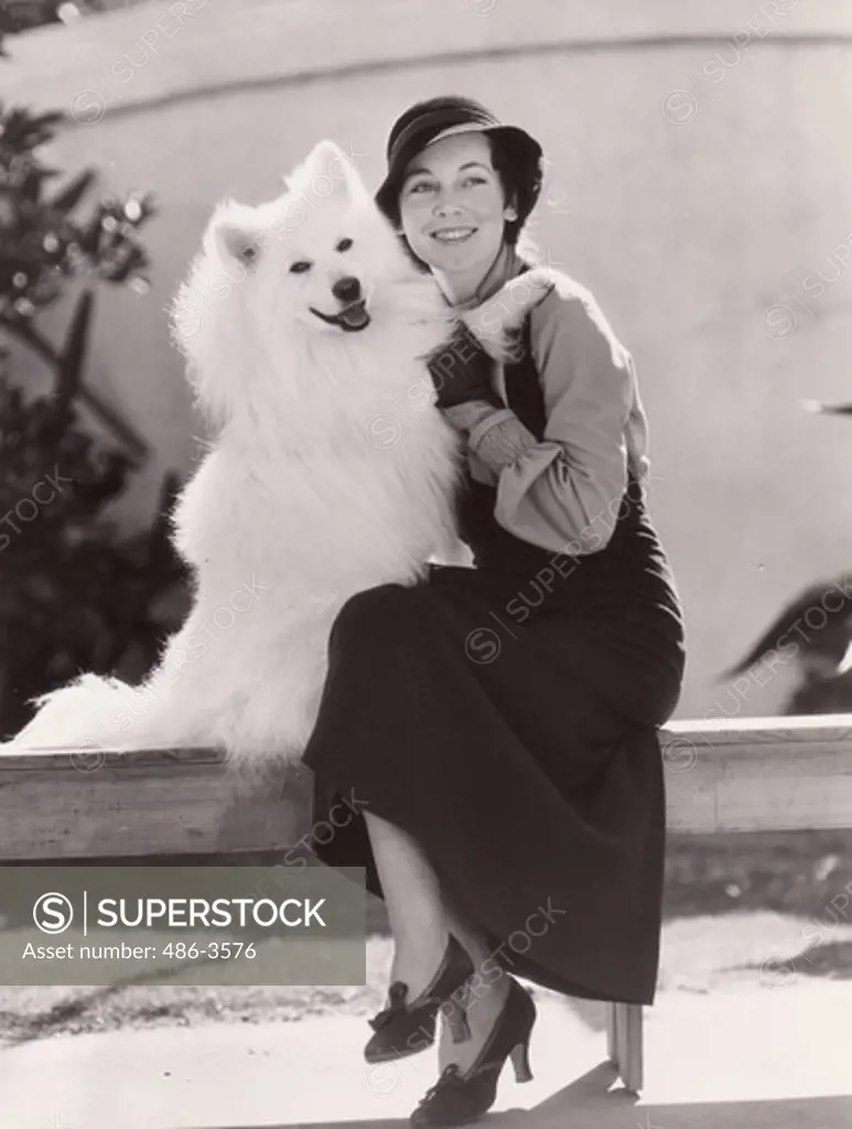 Maureen O'Sullivan, MGM featured player is shown with ""Sammy Boy"" Siberian Samoyede, one of the rarest breeds of canines in existence