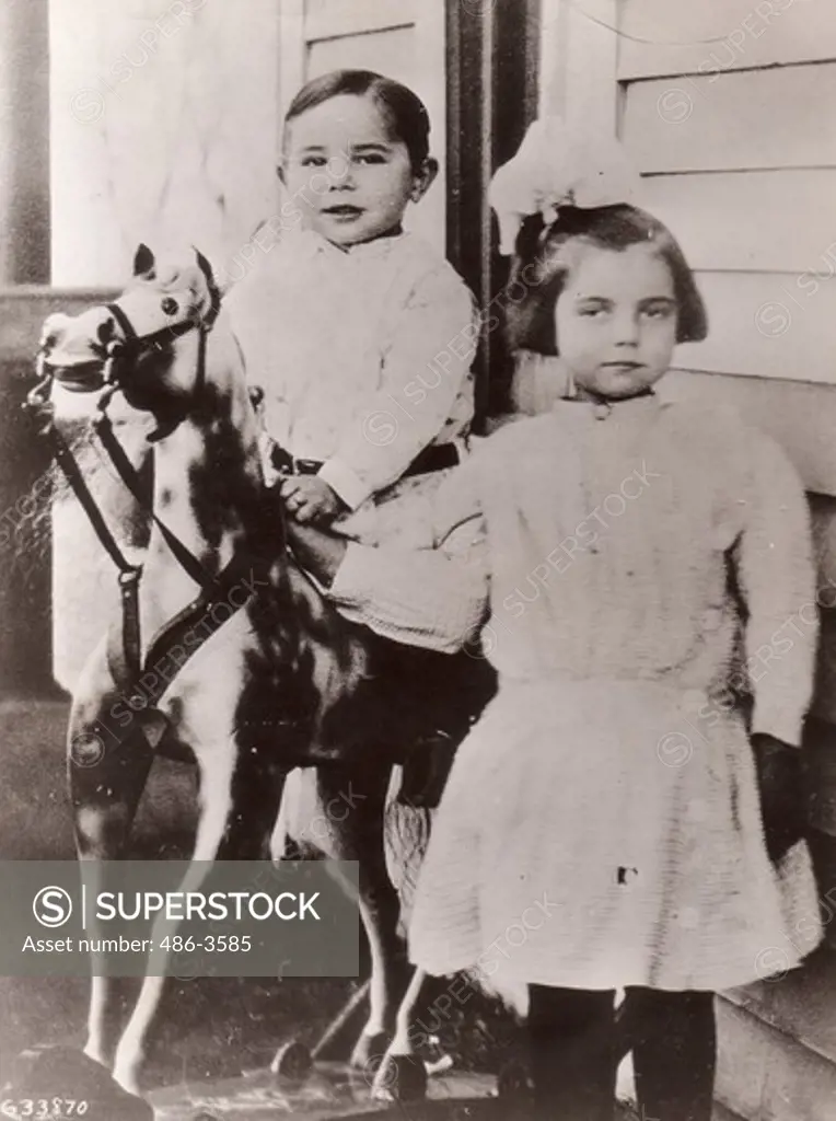 Max Baer, contender for Heavyweight Prizefighting Championship of world and appearing in MGM picture, ""The Prizefighter and Lady"", posing with his sister in picture taken during his childhood days in west