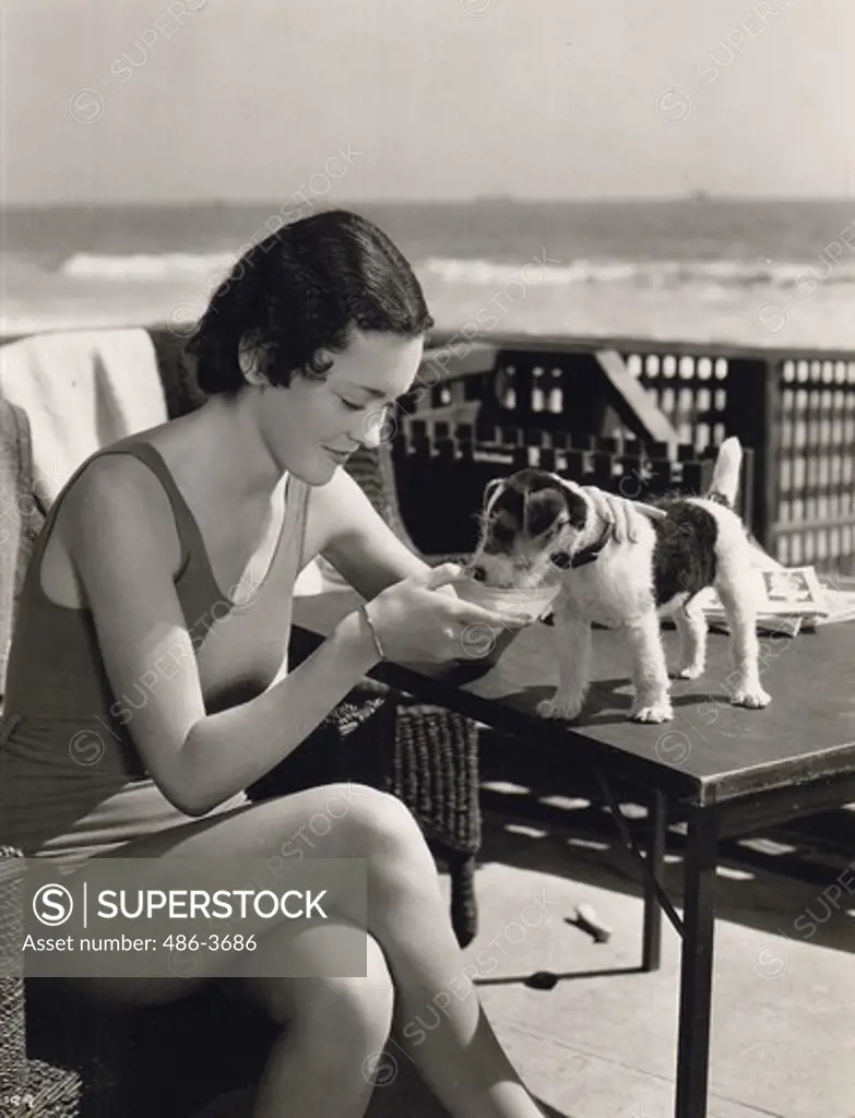 Maureen O'Sullivan, MGM featured player with her tiny wired hair puppy ""Junior"", Miss O'Sulivan will be seen in the new Dressler-Beery picture ""Tugboat Annie""