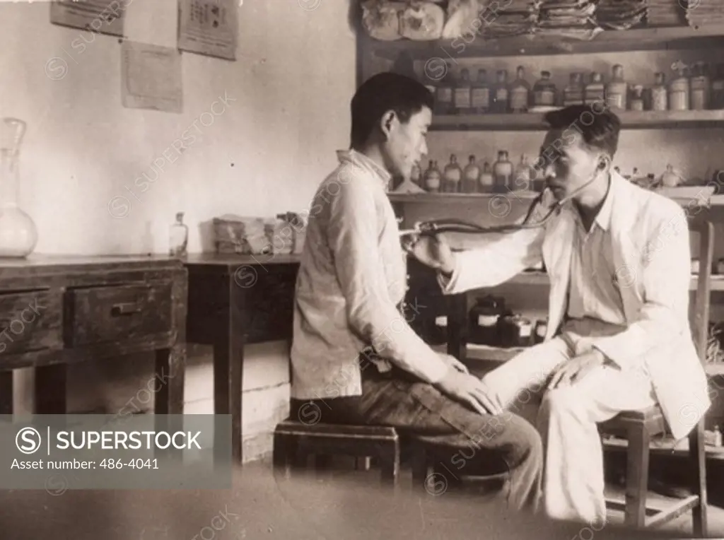 China, Lanchow, Dr Wu Shao-kau at work in his Chinese industrial Co-operative clinic