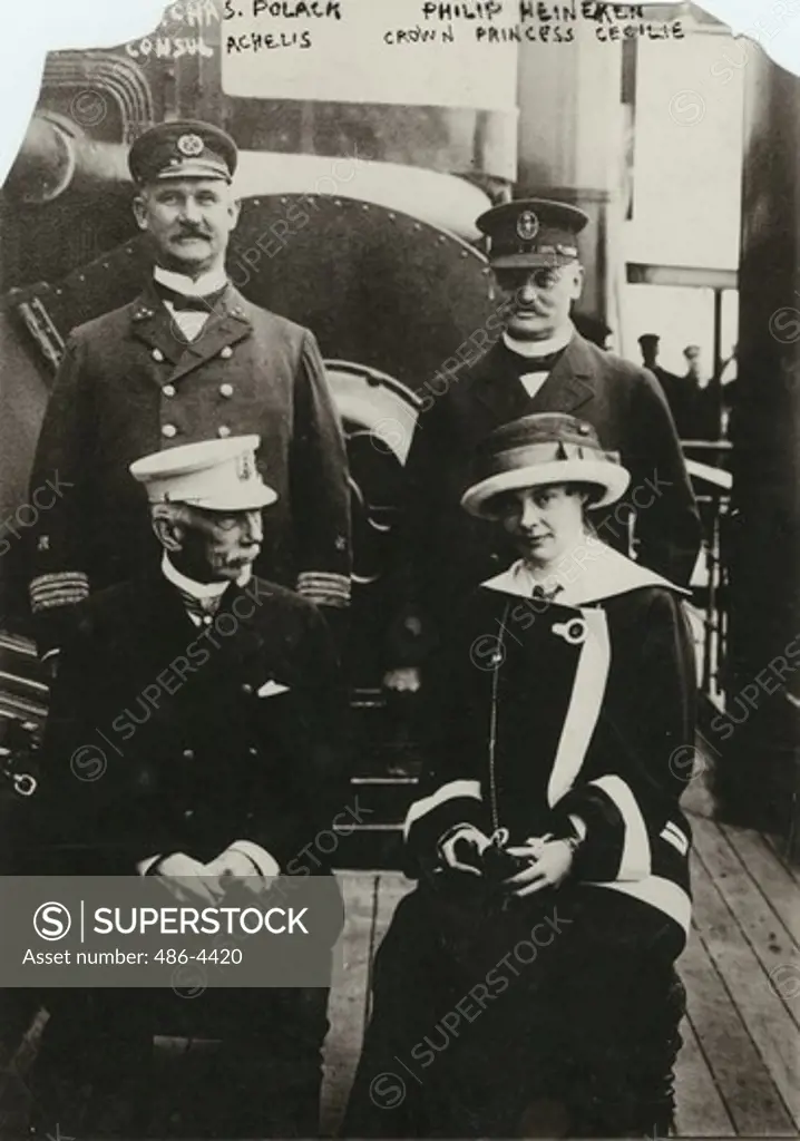 Capt. Chas Polack, Consul Archelis, Philip Heineken, Crown Princess Cecilie posing on boat