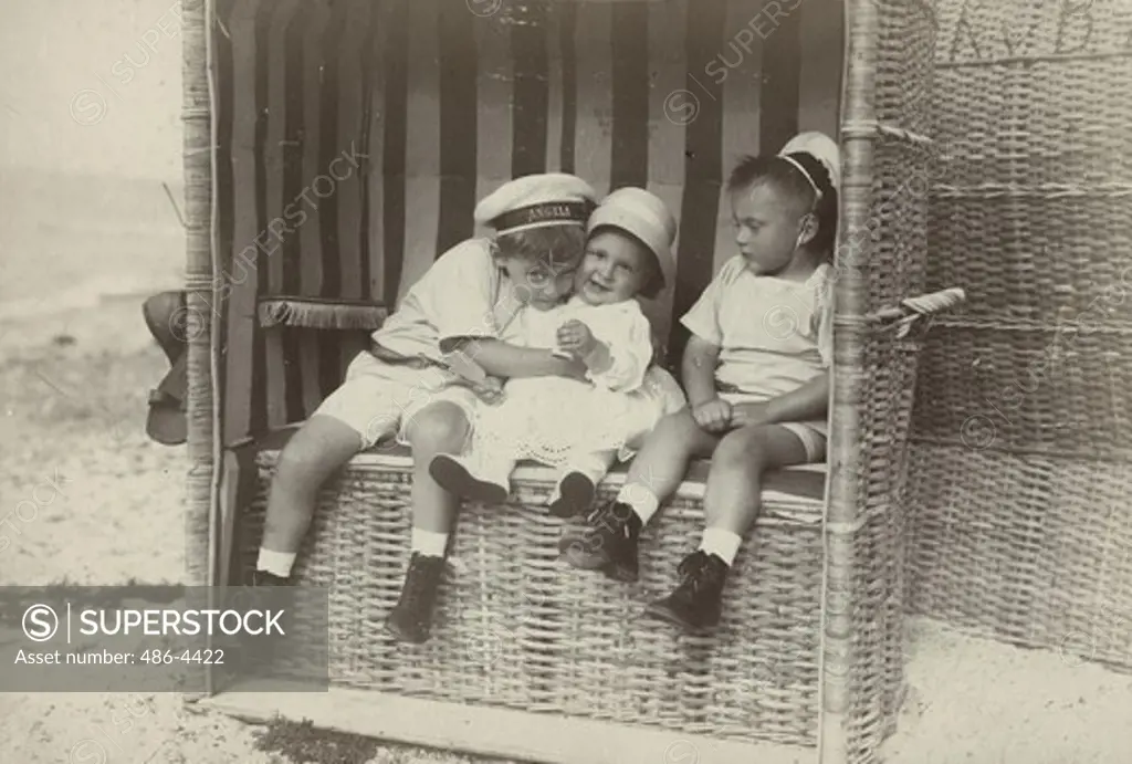 Children of Crown Prince of Germany sitting in beach basket