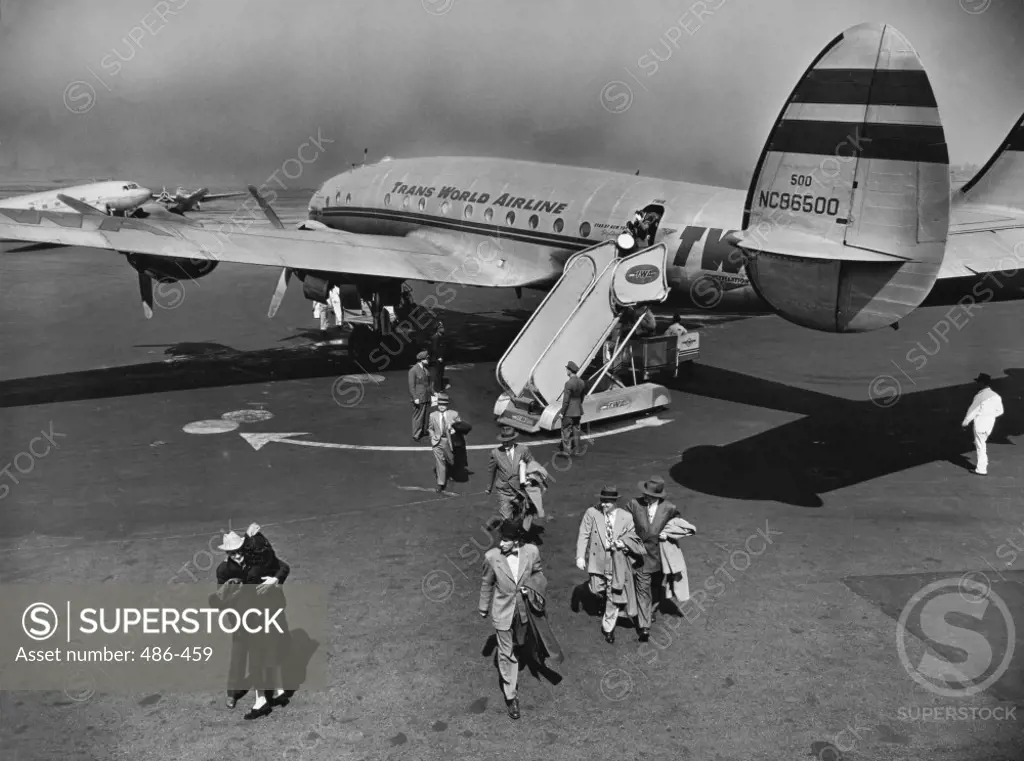 High angle view of passengers unloading off an airplane, Lockheed L-111 Constellation, LaGuardia Airport, New York City, USA, 1945