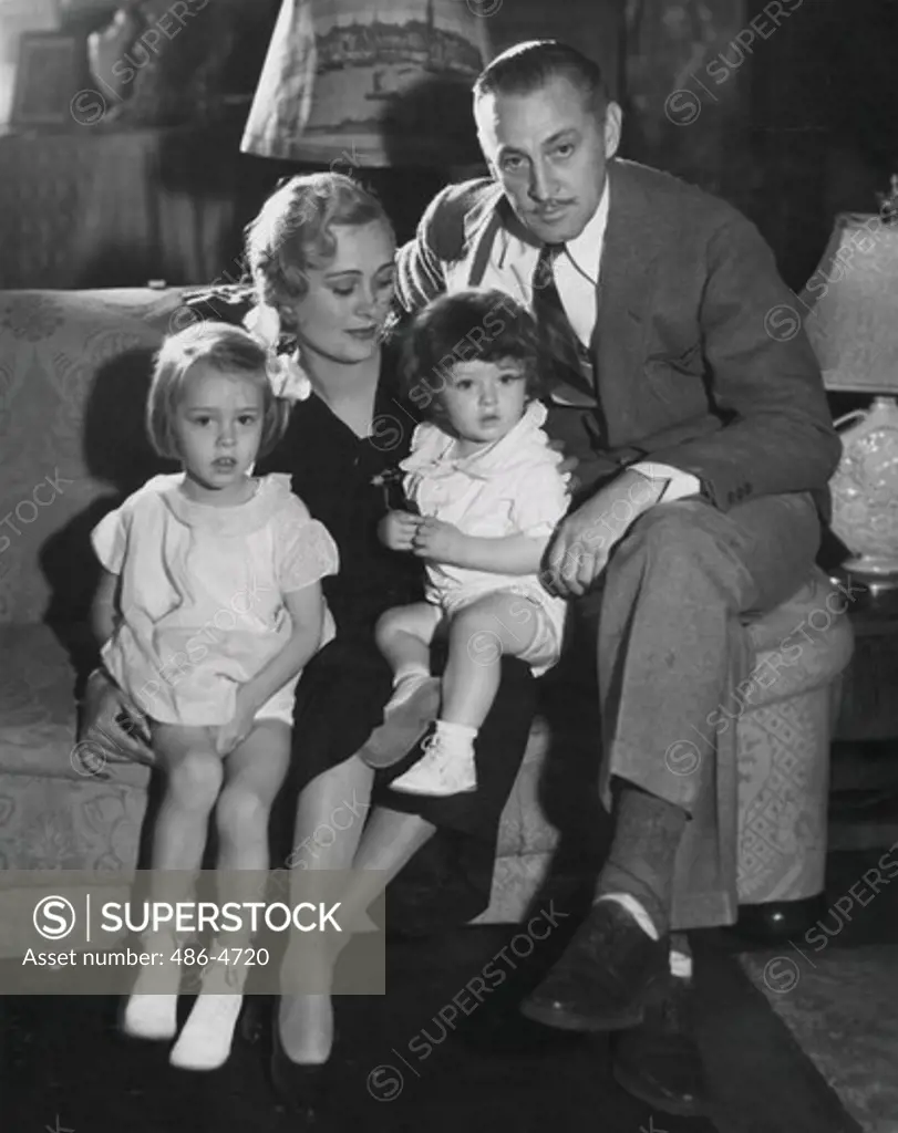 John Barrymore, star of Universal's ""Counsellor-at-law"" at his home with his wife, former Dolores Costello, and his children, Dolores Ethel Mae and John Blythe jr