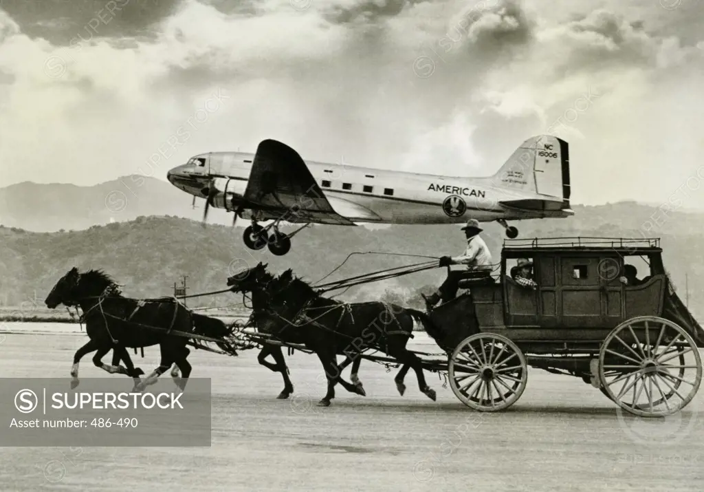 Aircraft flying over a stagecoach