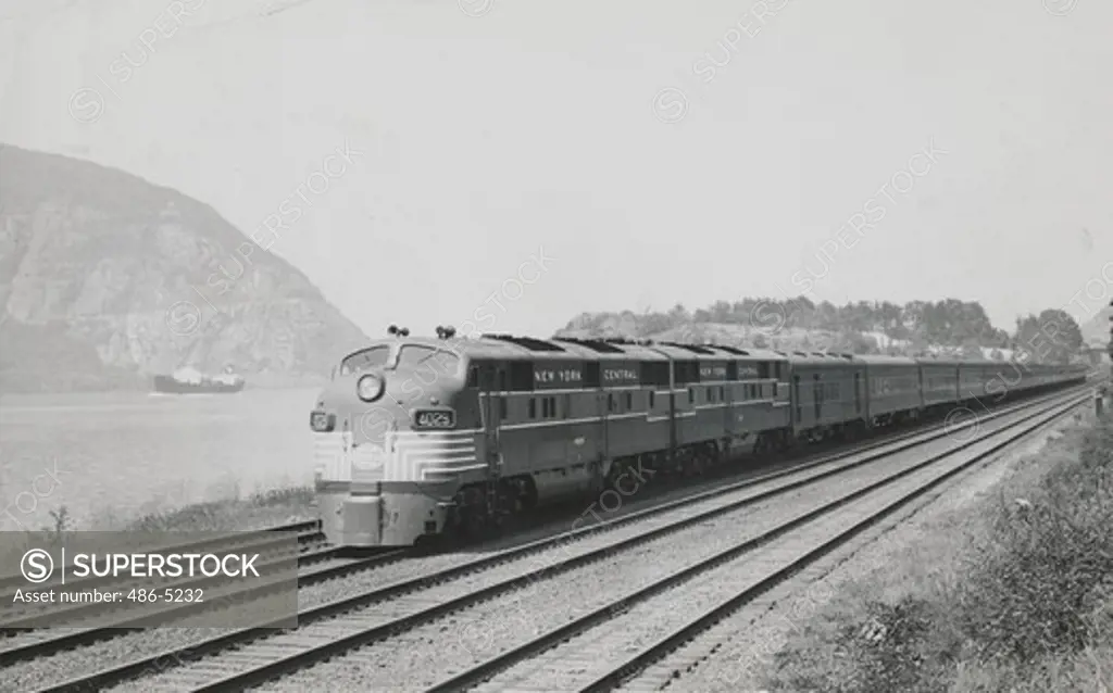 USA, New York Central Train running along Hudson River, 1948, 20th century limited speed along the hudson River, slept 9, during a special run. The sparkling New York Central Train, featuring every convenience of modern rail travel, will soon be in use between New York and Chicago, 1948
