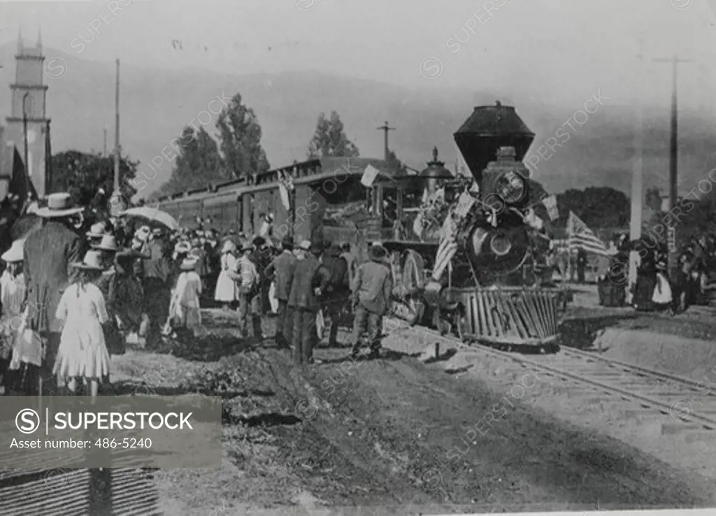 Passengers waiting for Huge Coffee Grinder train, 1887