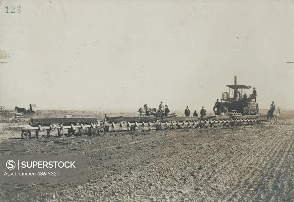 USA, California, Stockton, Holt steam tractor and plows, about 1900-1904, Plowing and seeding grain at the same time, a combination of jobs such as was typical of California farmers from the time they left the goldfields because of man storage and the ever-present urge to cut costs and increase profits.