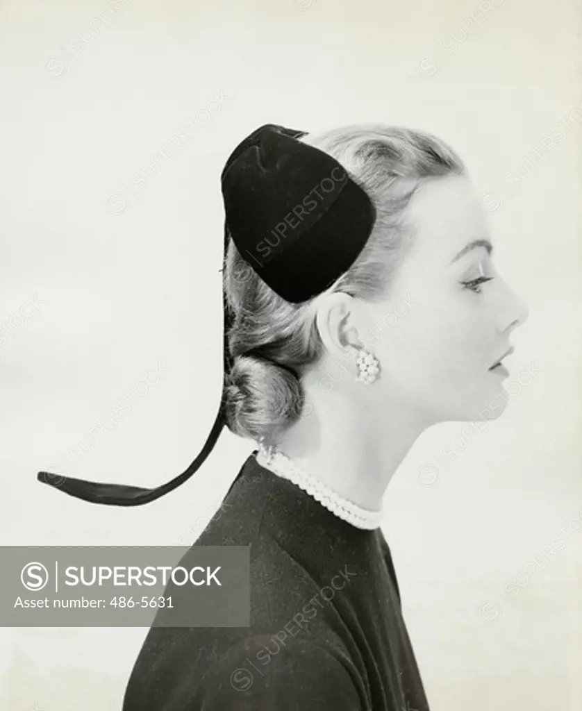 From Lilly Dache's Fall 1955 collection, her "" Pigtail"" of black velvet