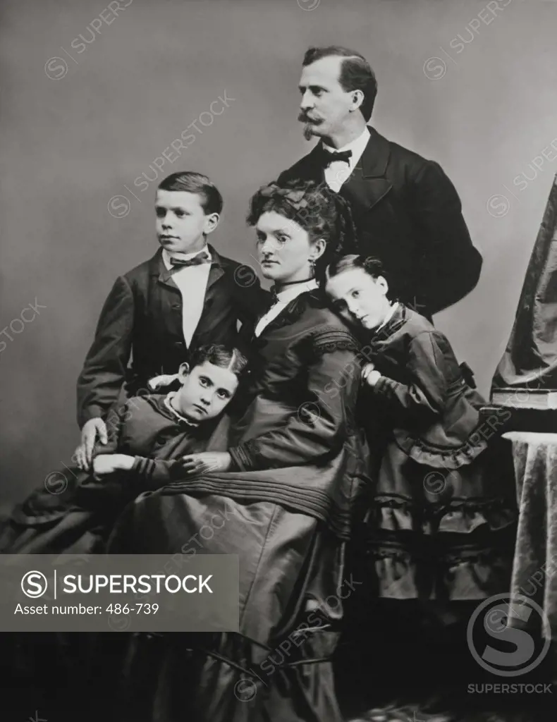 Parents with their two daughters and a son