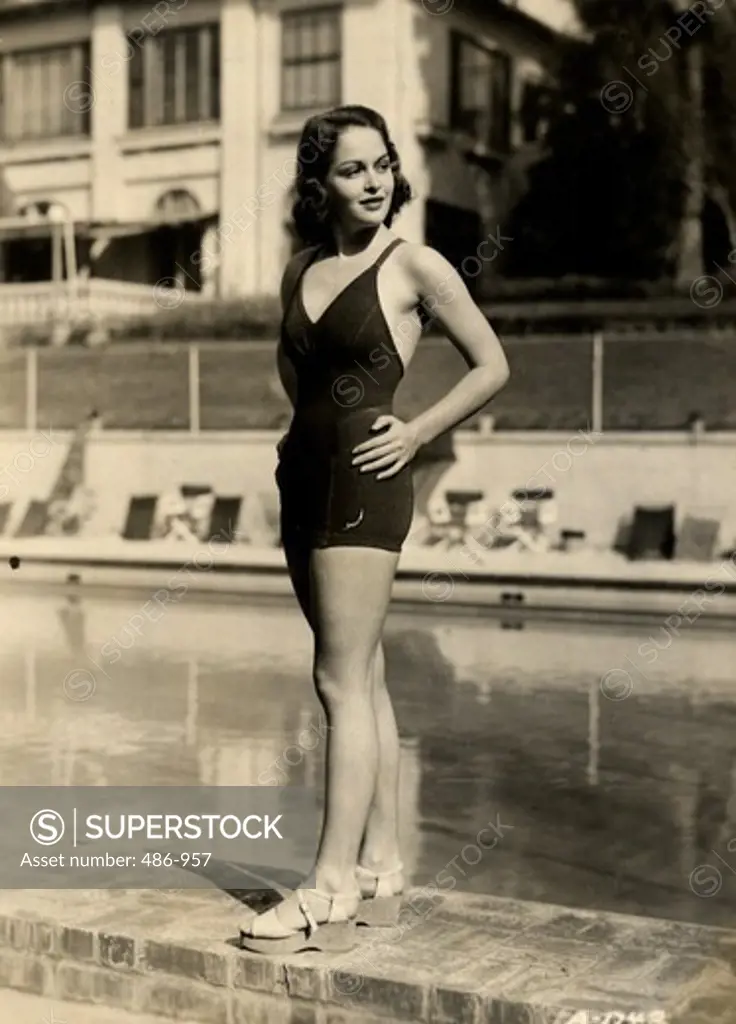 Portrait of young woman in swimwear at poolside