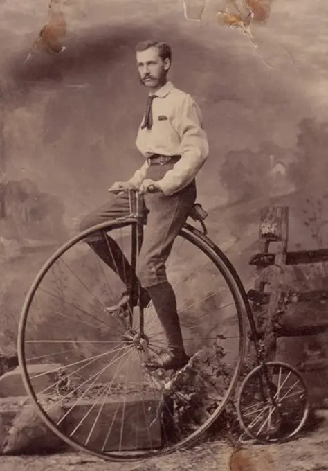 Man on penny farthing bicycle