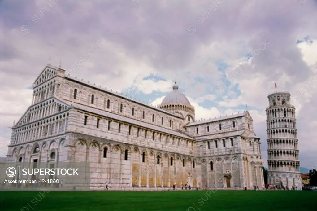 Low angle view of a cathedral near a bell tower, Duomo, Leaning Tower, Pisa, Italy