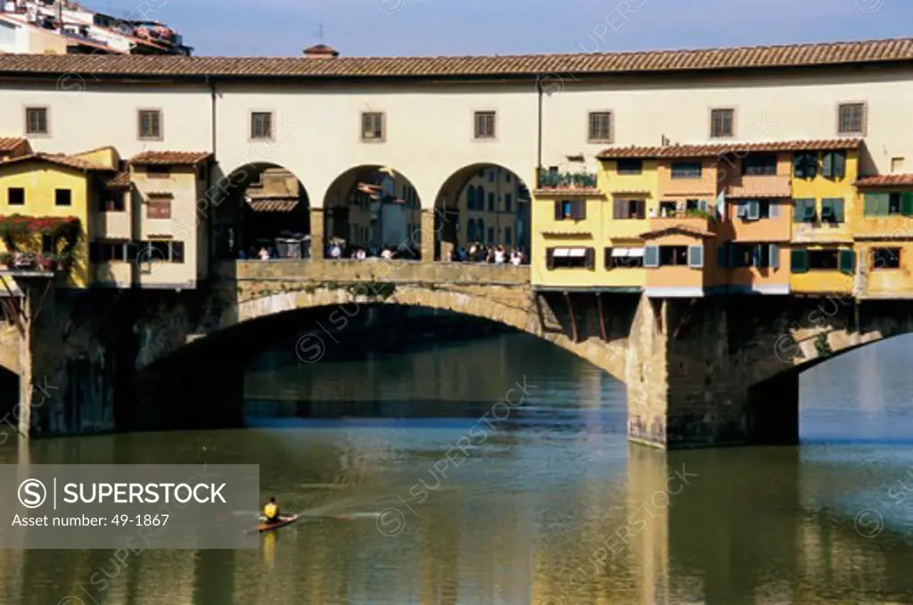 Arch bridge across a river, Ponte Vecchio, Florence, Italy