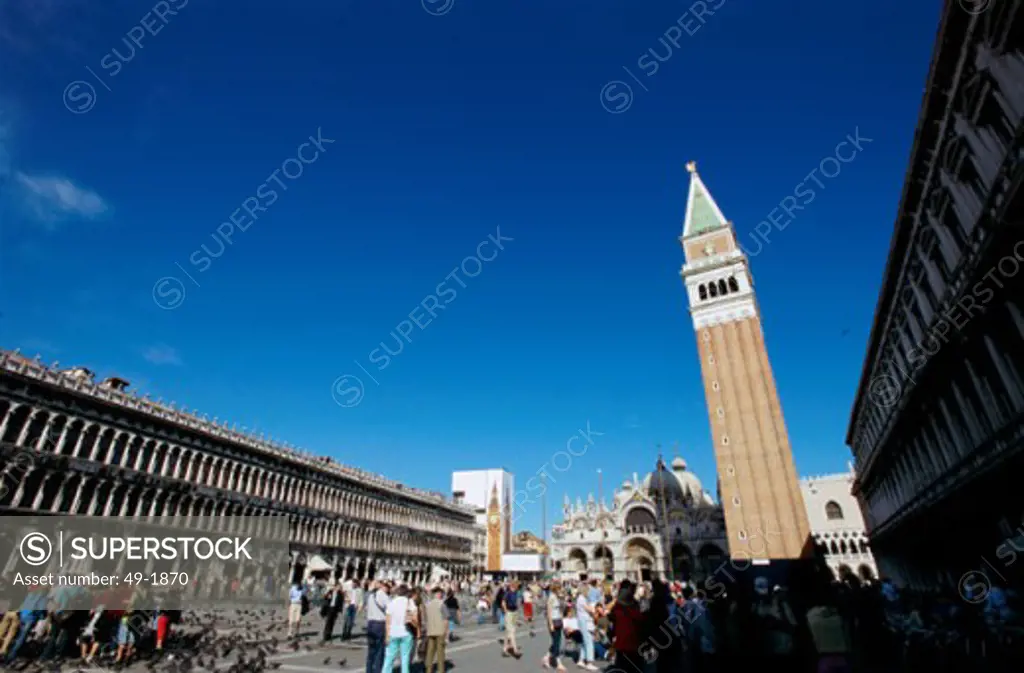 Low angle view of tourists in a town square, St. Mark's Square, Venice, Italy