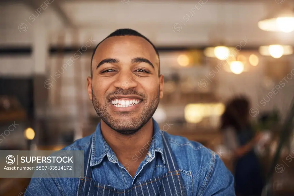 Coffee shop, happy waiter and portrait of black man in restaurant for service, working and smile in cafe. Small business owner, bistro startup and face of male waiter in cafeteria ready to serve