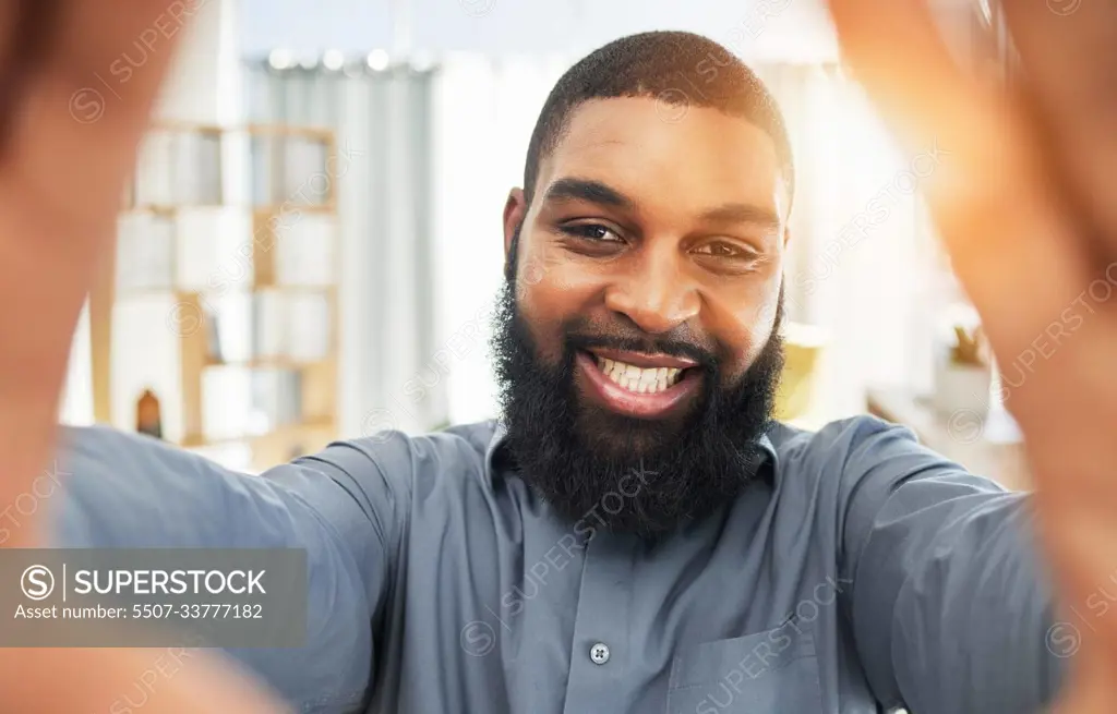 Smile, face and selfie of a black man as a business or influencer person at work. Portrait of an African guy or entrepreneur with job satisfaction and pride for social media profile picture or update