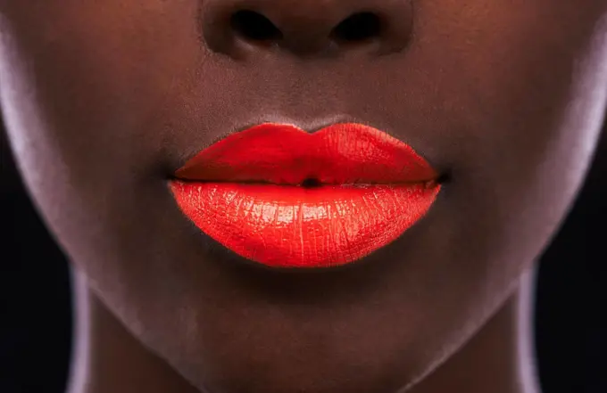 The perfect pout. Cropped view of an african woman with bright red lips.