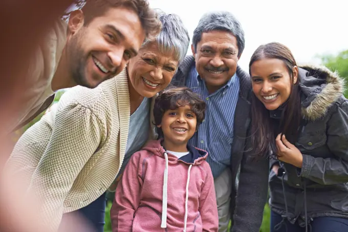 Simple moments make great memories. a multi-generational family posing for a self-portrait.
