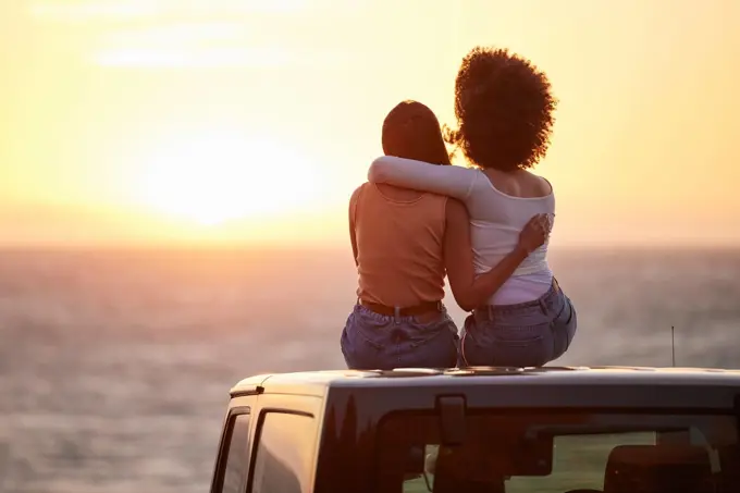 Love, gay and sunset with lesbian couple on car beach for relax, romance and sky mockup space. Lgbtq, freedom and pride with women hugging on nature date for partner, trust and summer vacation