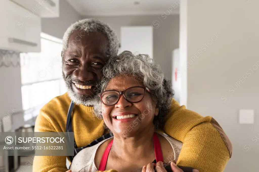 A senior African American couple spending time at home together, social distancing and self isolation in quarantine lockdown during coronavirus covid 19 epidemic 