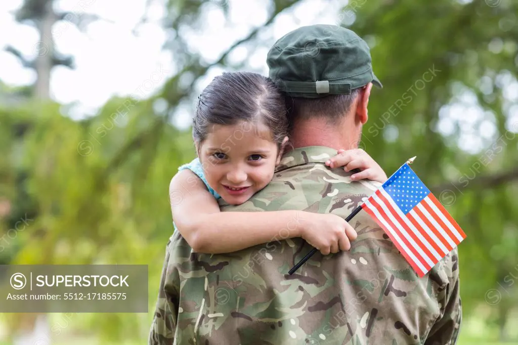 Soldier reunited with his daughter on a sunny day