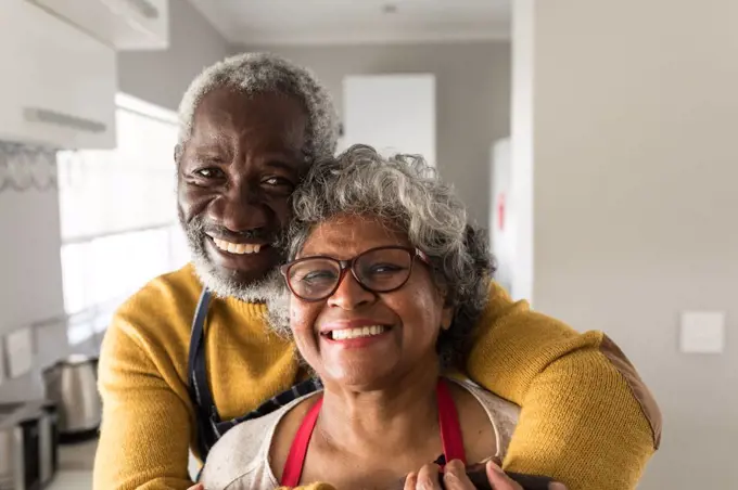 A senior African American couple spending time at home together, social distancing and self isolation in quarantine lockdown during coronavirus covid 19 epidemic 