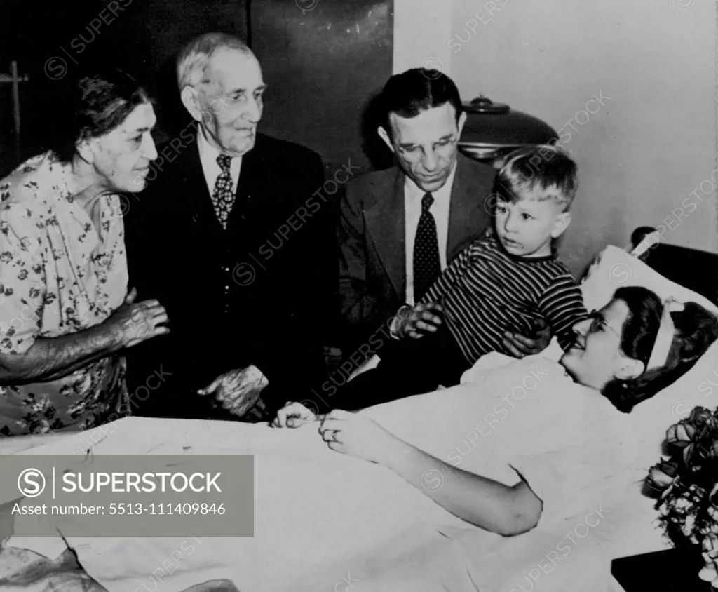 Story Of Quads -- Kin of Mrs. Andrew Zavada, mother of quadruplets born Sunday, hear from her own lips the story of her experience. On the left are Mr. and Mrs. W.F. Wagner, grandparents of Mrs. Zavada. Others are her husband (center) and son Larry. February 18, 1948. (Photo by AP Wirephoto).
