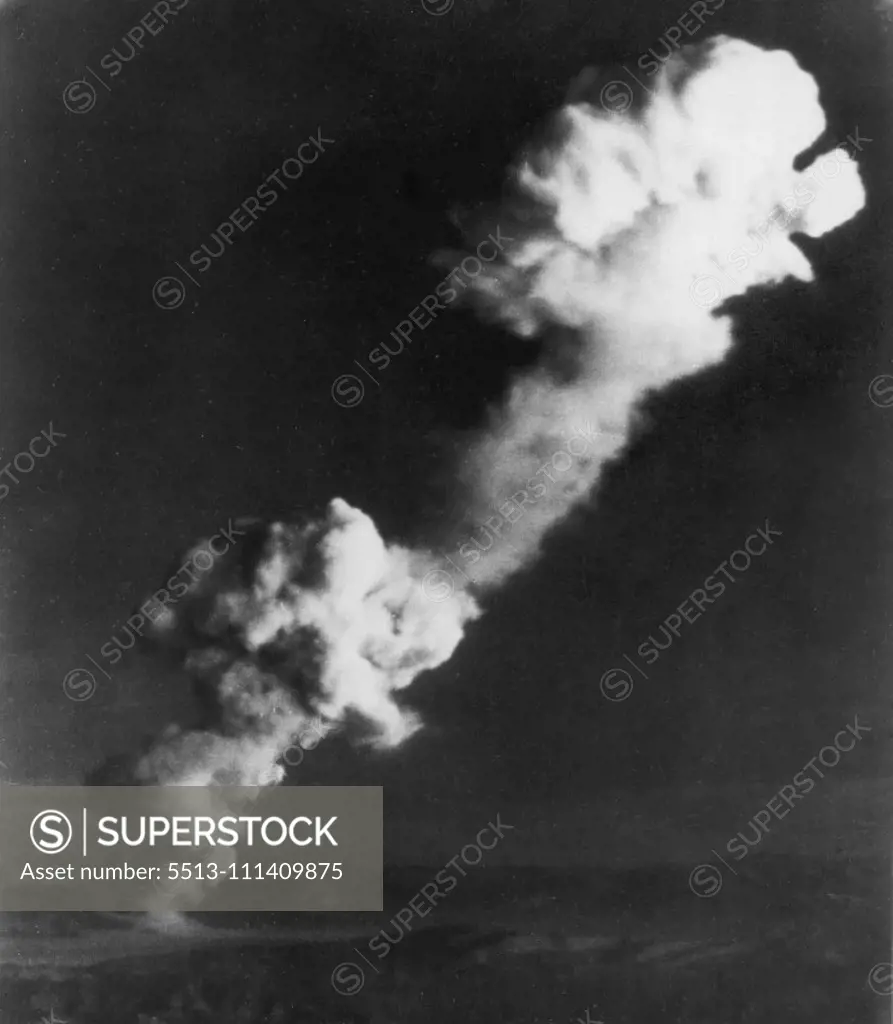New Atomic Blast Set Off -- Early morning risers got this view of the atomic cloud that formed after the AEC set off the second atomic explosion today in its series of spring tests. Picture was made from Mt. Charleston approximately 55 miles from Yucca flat where the test blast occurred. March 24, 1953. (Photo by AP Wirephoto).
