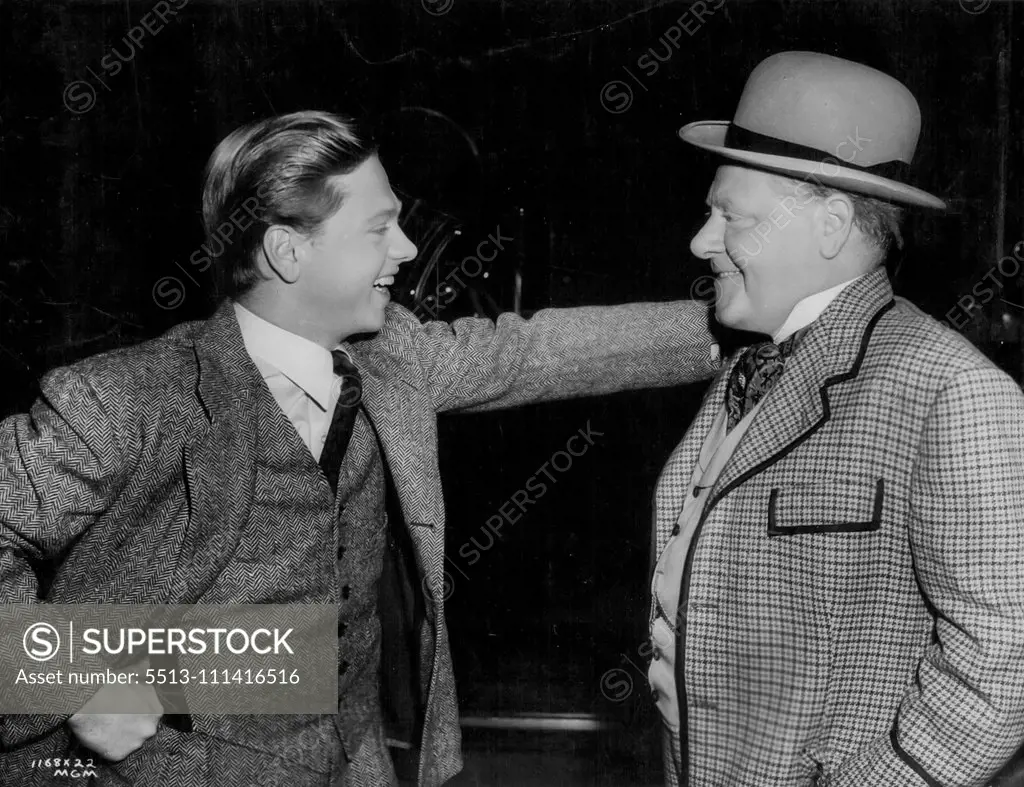 "Hello, Dad"... Mickey Rooney is visited on a set at Metro-Goldwyn-Mayer, by his father, Joe Yule, vaudeville and screen comedian. Yule is costumed for his role in a new Metro-Goldwyn-Mayer film. September 10, 1951.