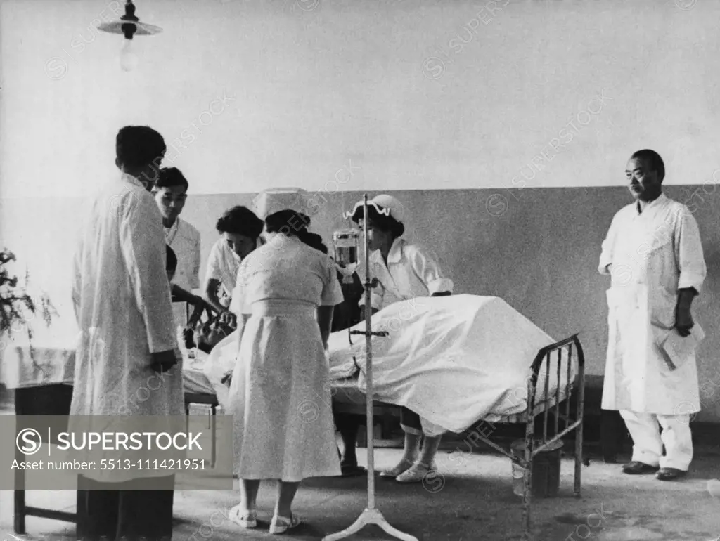 World's First Hydrogen Bomb Victim -- The scene in a Tokyo Hospital as Kuboyama is being given medical treatment. Aikichi Kuboyama, one of the 23 Japanese fishermen who were showered with radioactive ashes near Bikini waters last March when the U.S. made an H-Bomb tests has just died as the result of this test, and now the Japanese Government are asking for compensation from the U.S. for the family of Kuboyama. September 24, 1954.