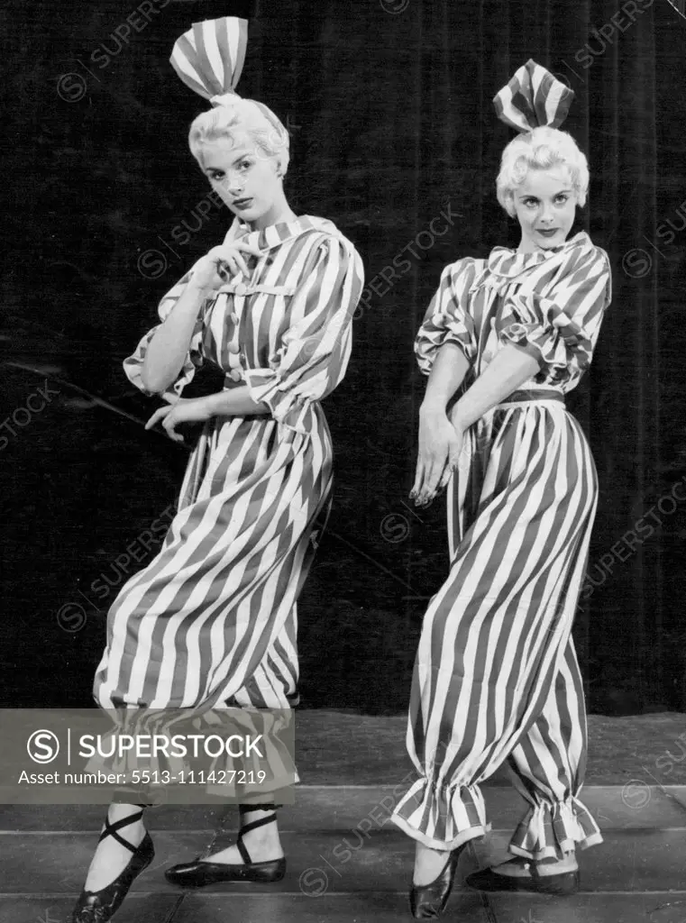 It's a Full Dress Flashback -- The style is borrowed from Good Queen Victoria's day, but the pretty blondes are definitely 1955. They are Windmill Girls Jullian Larnaby (left) of Liverpool and Jill Turner of Tooting, London. They are featured as Victorian bathing belles in an amusing number in 'Revudeville' at London's famous Windmill (we never closed) Theatre. October 04, 1955. (Photo by Reuterphoto).