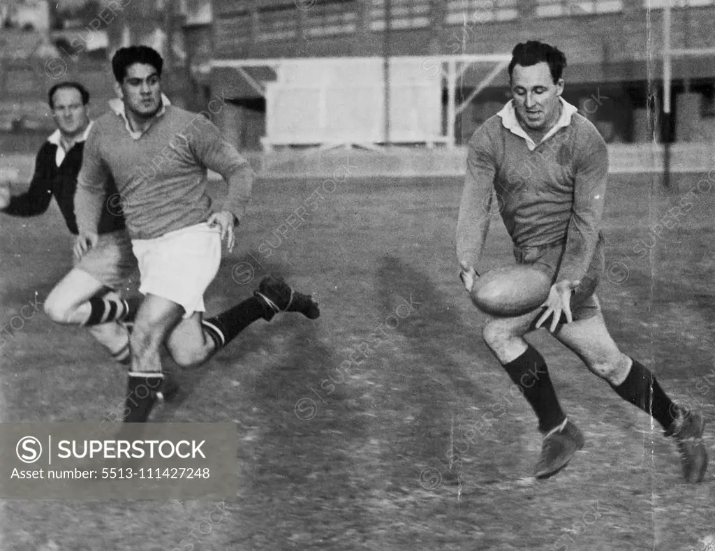 Col Windon, who was lead the Australian Rugby Union forwards in next Saturday's Test against the Maoris, takes a pass during training. June 20, 1949.