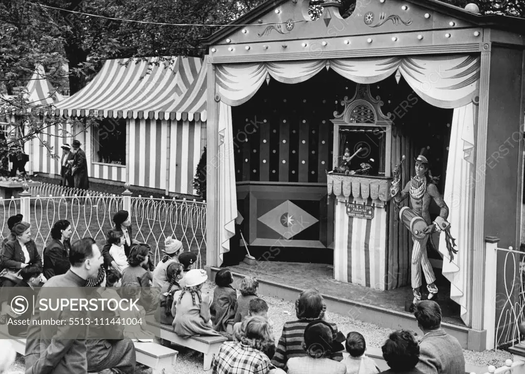 Festival Gardens At Batter sea are Open Today -- The first Punch and Judy show to be held attracts a crowd among the early visitors to the newly opened Festival Gardens today. May 28, 1951. (Photo by Fox Photos).