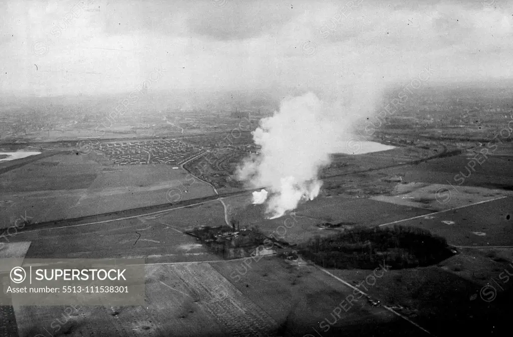 Cologne: These air pictures taken on (5.3.45) by an RAF official photographer of Cologne, which has been entered by U.S. troops show the scene two miles outside Cologne as smoke from bursting marker shells drifts across the countryside. Standing out from the heavy smoke pall is Cologne Cathedral in the far distance. March 1, 1945. (Photo by British Official Photo).