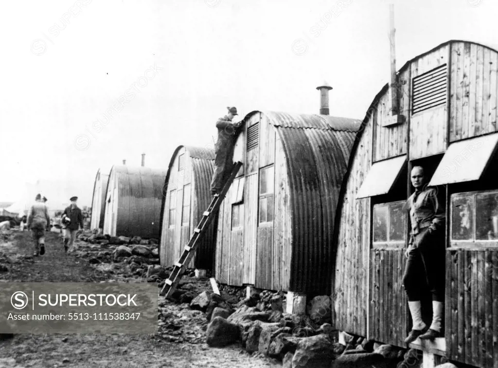 U.S. Marine with 'Situation Well in Hand' Iceland - This U.S. marine at work on a Nissen hut seems to have the situation well in hand as he applies the finishing touches. Official U.S. Navy Photo released yesterday in Washington shows scene in camp near Reykjavik, in American defended Iceland. October 17, 1941. (Photo by ACME).