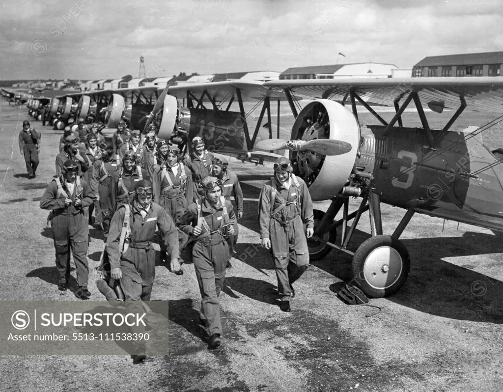 Cadets March Out to Planes: Two Dozen members of the pursuit squadron at the army's flying school at Kelly field march out to their planes for their final flight before graduation exercises. The fliers made their final bow a diving salute with motors wide opens at an elevation of between 50 and 100 feet. October 6, 1937. (Photo by Associated Press Photo).