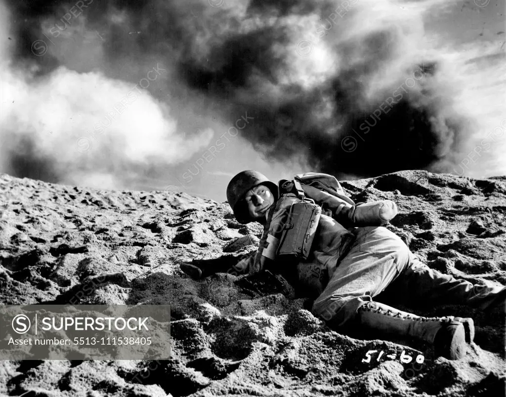 Movie Wars Go On: Near Miss! as the actual explosion goes off, film comedian sterling Holloway hugs the earth in this scene from the movie. November 23, 1945. (Photo by ACME).
