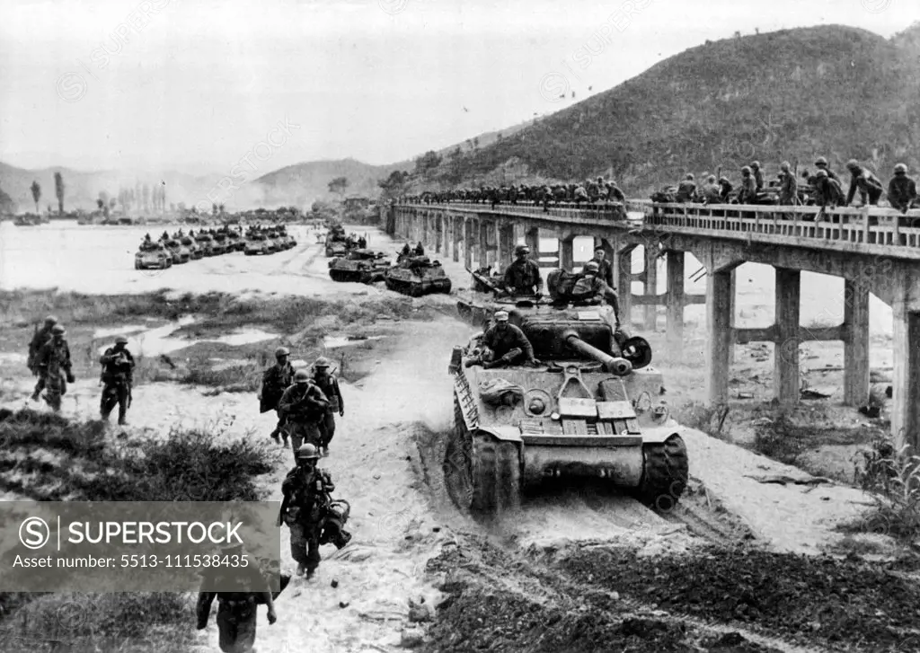 The war in Korea Across the front, the retreating enemy goal, and apparently prepared its resistance in the immediately adjacent perimeter of the capital. Americans and South Koreans are 50 km from Pyongyang. A column of tanks of ***** Infantry Division bypasses a damaged bridge on the Hwang-Gang river. October 17, 1950.