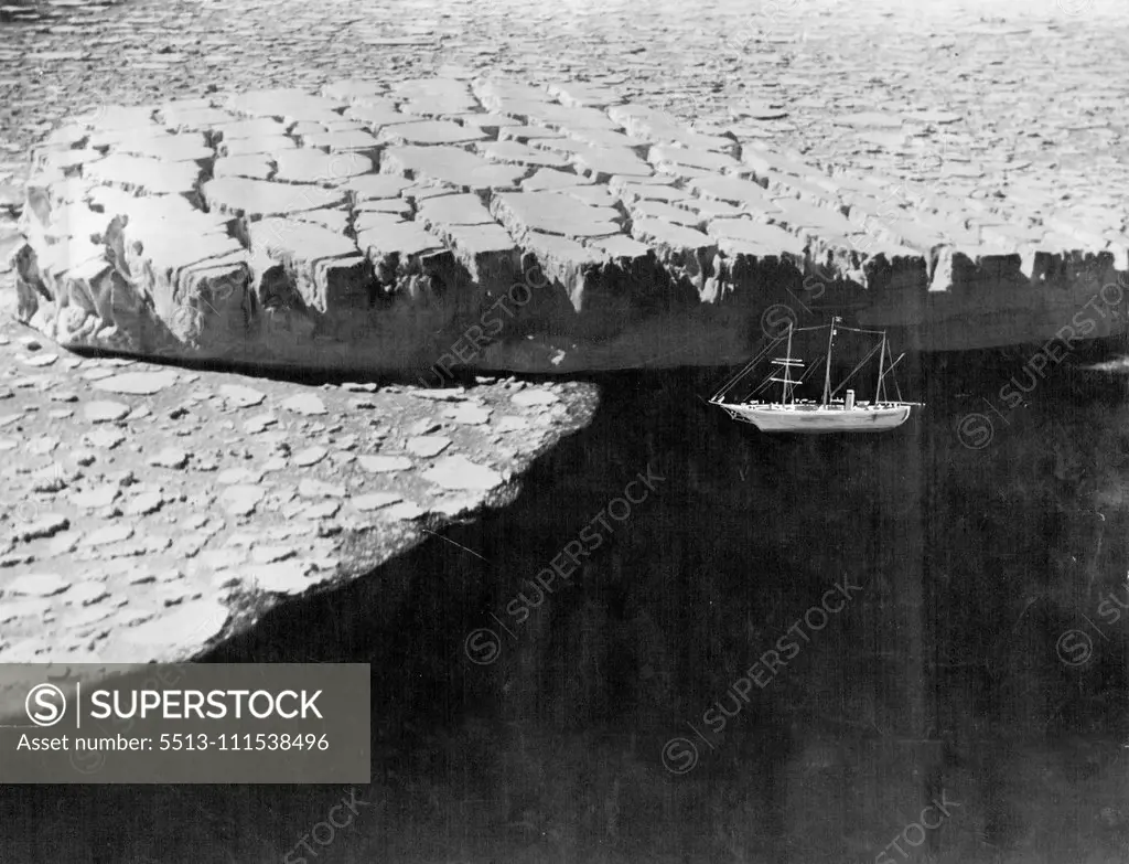 Drifting with the Ice: A remarkable serial view which looks down on to the crevassed surface of iceberg drifting with the pack ice off the ***** of MacRobertson Land, Antarctic. The berg, which has been cast adrift from an intensely crevassed ***** is nearly 200 feet in height. May 12, 1930. (Photo by Captain Frank Hurley, The Herald Feature Service).