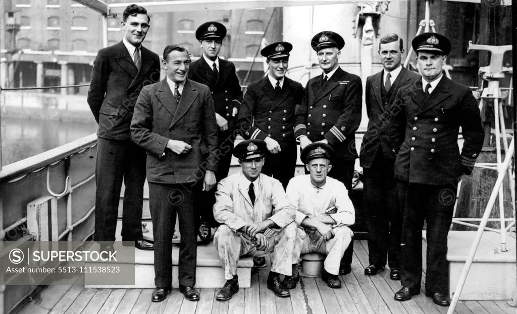 "Discovery II" Prepares to leave for 20-months cruise of Antarctic: Sub. Lieut. Marchesi; Dr. J. R. Strong; Lieut. T. H. Cates; Lieut. H. Hirrwood; Commander ***** (Chief scientist) and L. C. Hill, and seated R. S. Gourly and R. Porteous. The Royal Research ship discovery II in about to leave London for her fourth commission in the Antarctic. She is expected to sail from St. Katherine Dock on Thursday, and to be absent from home for about 20 months. October 1, 1935. (Photo by Keystone).