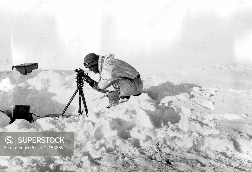 British Arctic Air Route Expedition: Chapman taking observations with theodolite near the ice cap station. July 30, 1931. (Photo by J. R. Rymill, British Arctic Air Route Expedition Photograph).