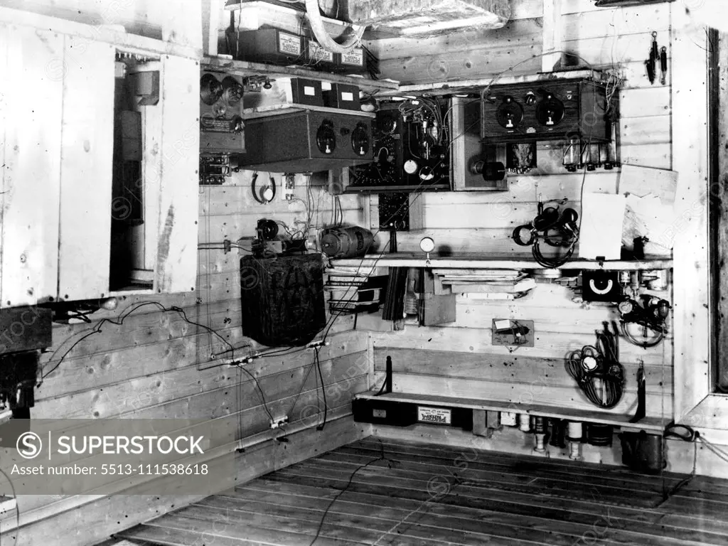 British Arctic Air Route Expedition: The expedition's wireless station GKN which occupies a corner of the main room of the hut at the Base Camp. July 30, 1931. (Photo by Cozens, British Arctic Air Route Expedition Photograph).
